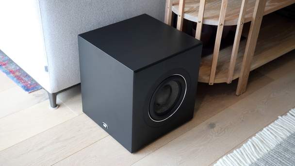 psb-bp8-subwoofer-black-behind-couch.jpg
